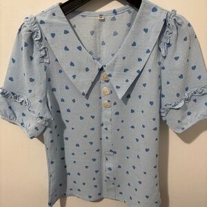 “Sky Blue Waist-Length Top with heart print and a free black side zipper top”